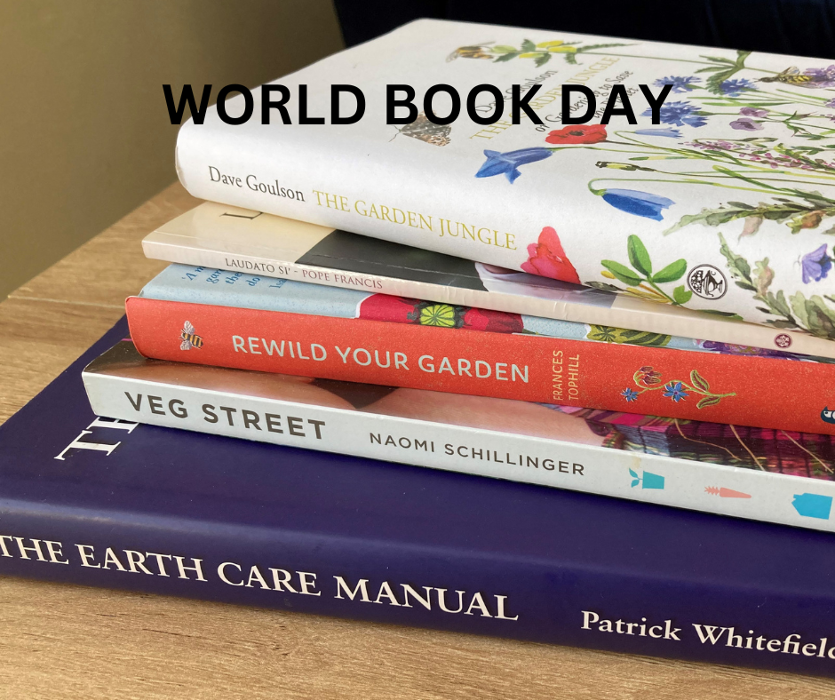 A pile of books o a table with the words World Book Day across the top of the image